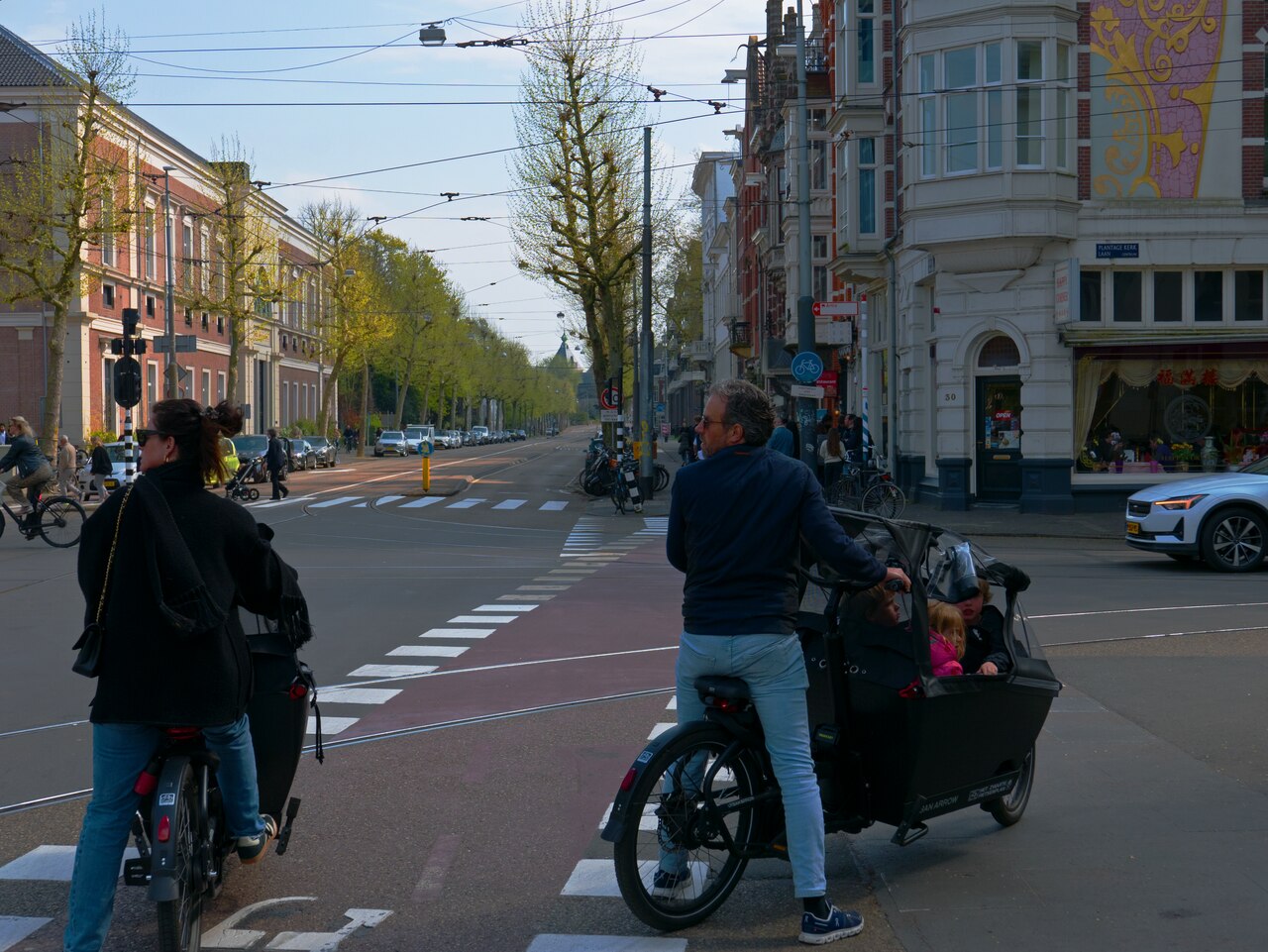 A family cycling together in Amsterdam, the Netherlands